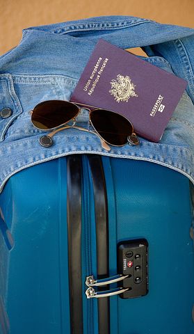 suitcase, passport and sunglasses